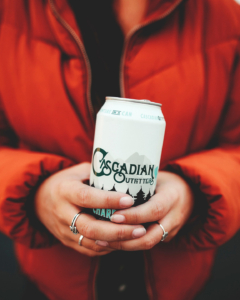 Cascadian Outfitters Chardonnay 335mL Can – Beauty – Holding bottle